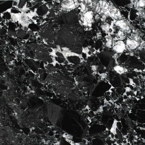 Close-up of a black and white marbled stone surface