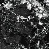 Close-up of a black and white marbled stone surface